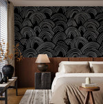 Minimalist Midnight Lines wave wallpaper above a wood headboard with beige bedding and dark lamp
