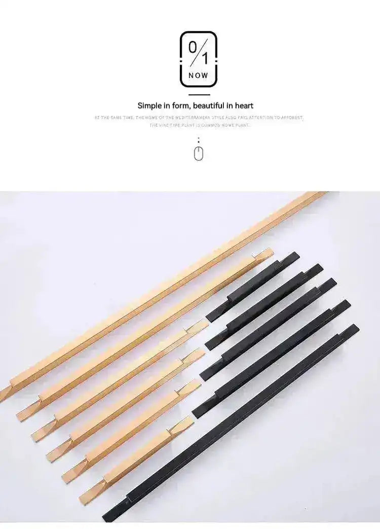 Long cabinet drawer pulls in gold and matte black finishes fanned on white background, flat lay