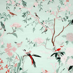 Mint Blossom Melody Hand Tufted Area Rug showcasing a serene nature-inspired design with birds and flowers, perfect for enhancing living room spaces. This wool rug offers a harmonious blend of colors, making it an ideal choice for those seeking elegant area rugs for living room decor.