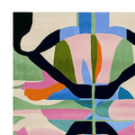 Vibrant and contemporary area rug featuring an abstract design with bold colors like blue, pink, orange, and green. This wool rug is perfect for adding a splash of modern art to your living room area. Ideal for large living room spaces, the hand-tufted texture enhances its luxurious feel.