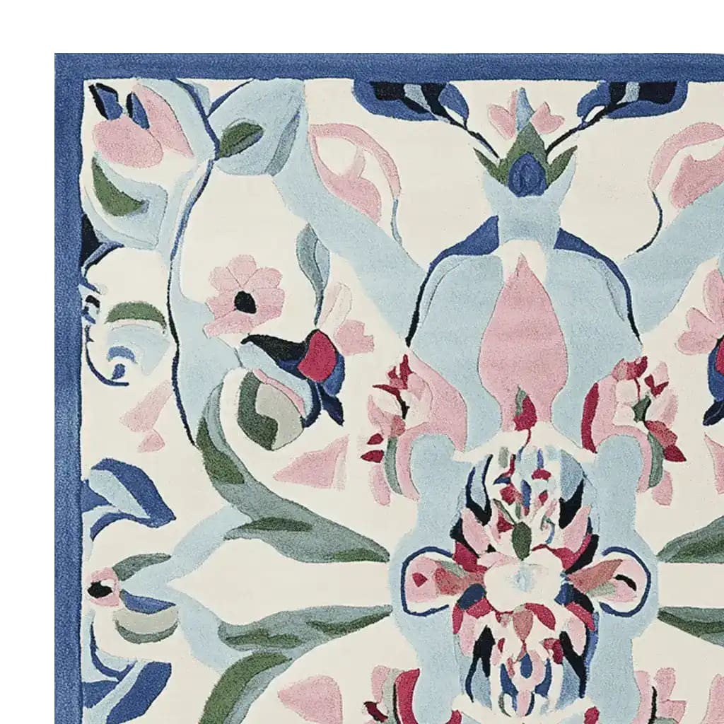 A beautifully detailed Mirrored Petal Harmony hand-tufted area rug, featuring an abstract floral design in soft pastel colors like pink, blue, and green. Perfect for adding elegance to large living rooms, this wool rug showcases intricate patterns that create a harmonious and inviting atmosphere.