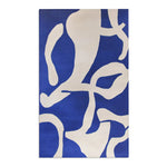 Modern Abstract Blue & White Rug full view under warm top lighting — bright even illumination revealing navy and cobalt pile colors