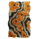 The Modern Botanical Flow Hand Tufted Rug is an eye-catching area rug featuring an abstract design with flowing lines and bold, orange floral patterns. This contemporary wool rug adds a touch of elegance and vibrancy to any living room, making it a perfect choice for those seeking stylish area rugs for living room spaces.