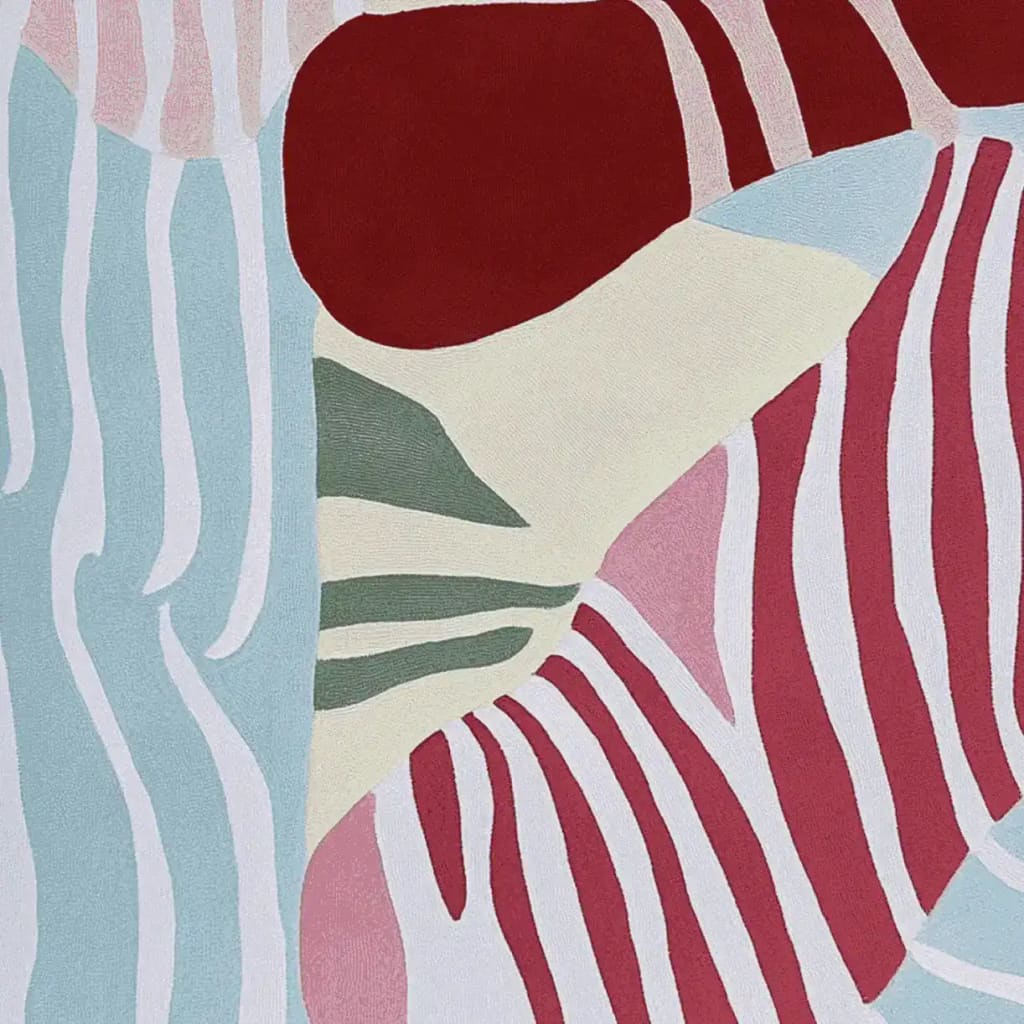 This area rug showcases a vibrant, abstract design with bold red, blue, and cream colors, perfect for adding a contemporary touch to your living room. Hand-tufted from premium wool, this contemporary rug offers both style and comfort.