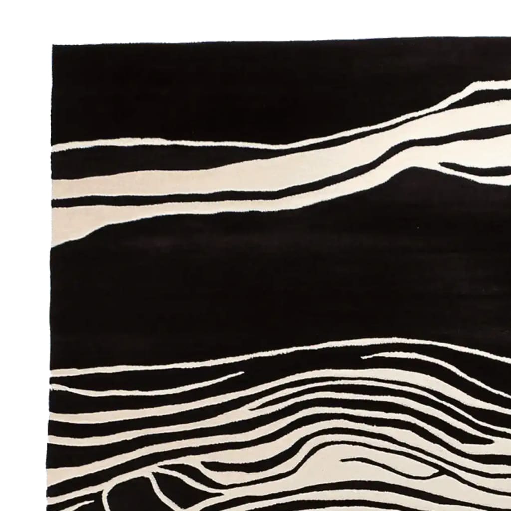 A stunning area rug featuring a bold black and white abstract design, perfect for contemporary living rooms. This wool rug, sized 8x10, adds a modern touch to any space, making it an ideal choice for those seeking living room area rugs that combine style and comfort.