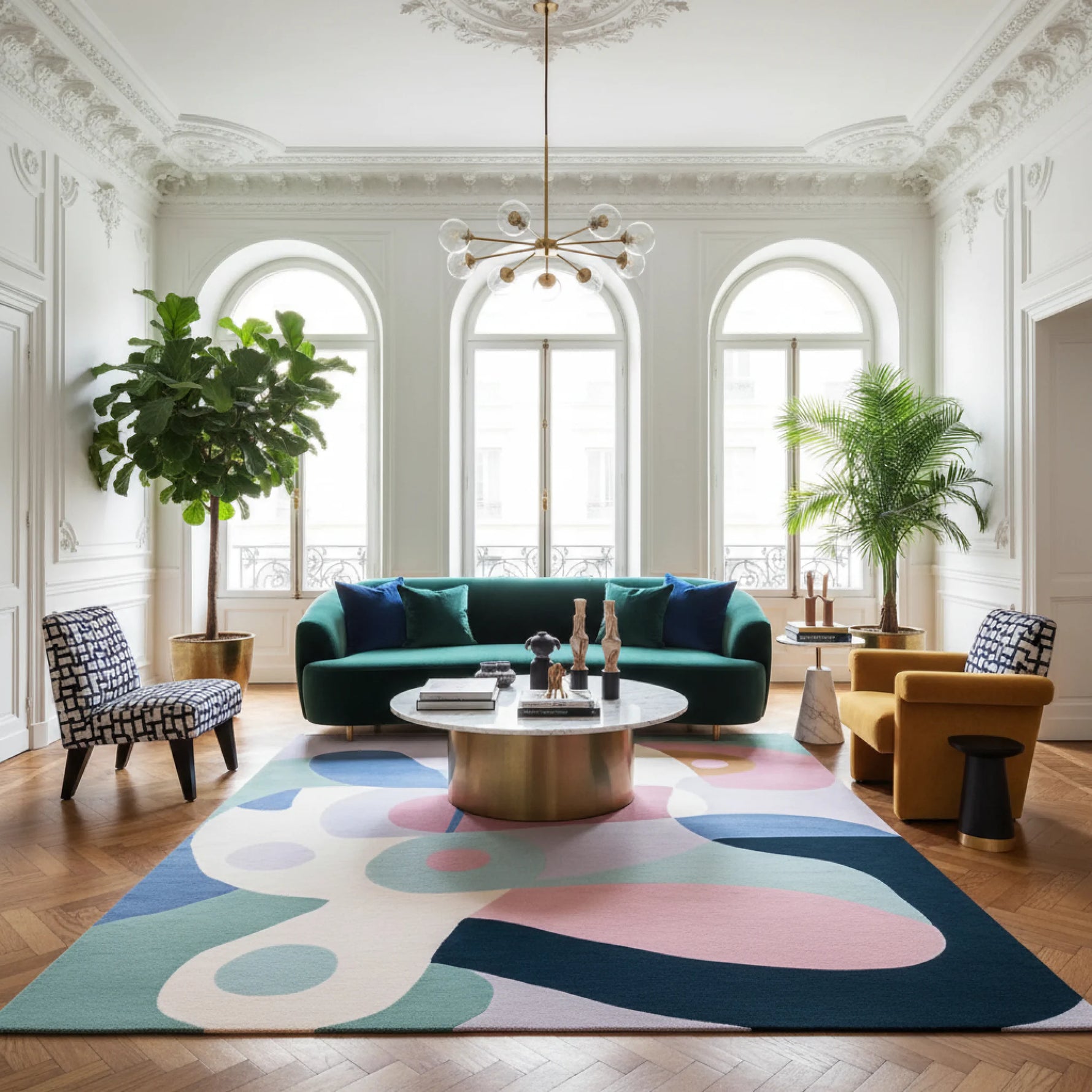 Modern living room with a colorful rug, green sofa, and decorative items.