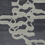 Top view of a Modern Psyche Flow Hand Tufted Area Rug, showcasing its contemporary abstract design in shades of grey and black. This wool rug is perfect for adding a stylish touch to living room area rugs, making it an ideal choice for area rugs for living room decor.