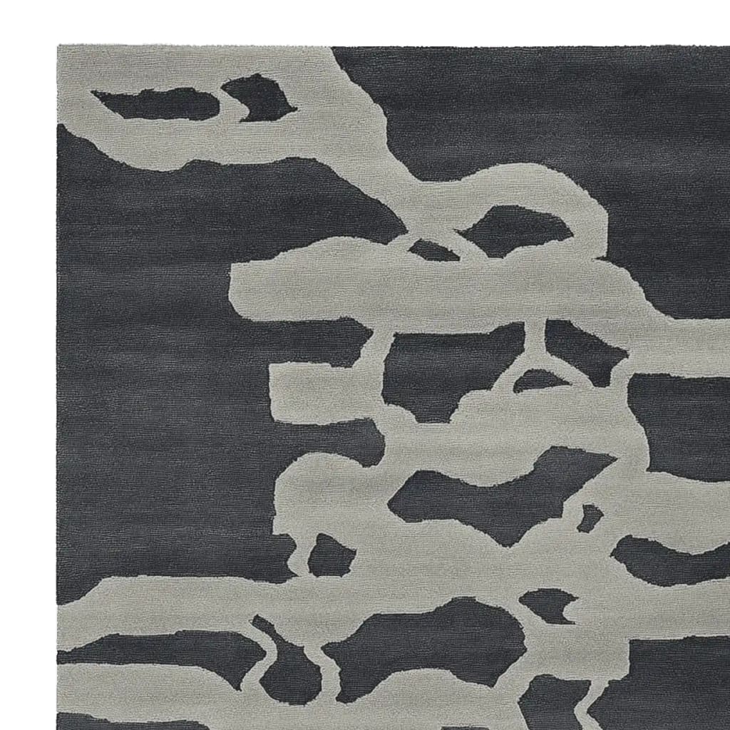 Top view of a Modern Psyche Flow Hand Tufted Area Rug, featuring an abstract design with gray and black tones. This contemporary wool rug is perfect for adding a stylish touch to living room area rugs collection. Ideal for those seeking area rugs for living room with a modern flair.