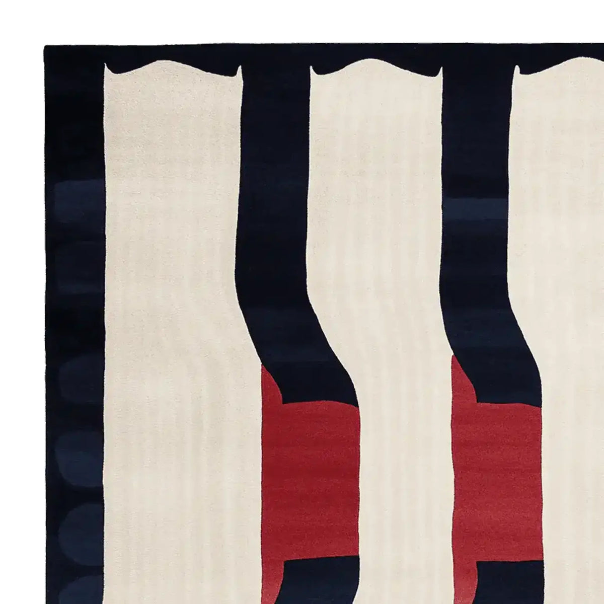 Close-up of a modern hand-tufted area rug featuring bold geometric patterns in navy, red, and cream. This contemporary wool rug is perfect for adding a stylish touch to large living rooms. Ideal as an 8x10 living room rug.