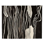 Elegant area rug with a striking abstract black and white zebra stripe pattern, perfect for adding a contemporary touch to any living room. This hand tufted wool rug combines modern aesthetics with the warmth and texture of natural fibers, making it an ideal choice for stylish living room area rugs.