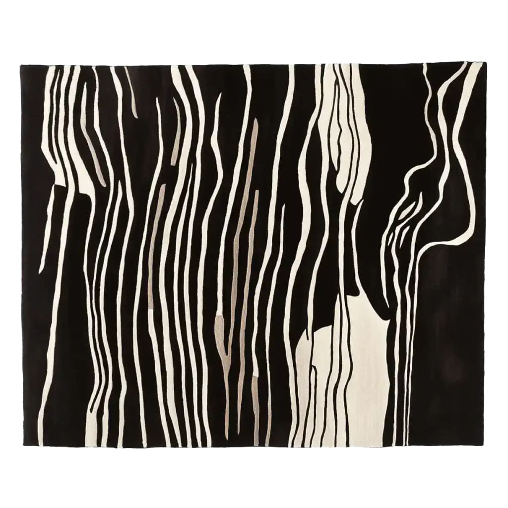 Elegant area rug with a striking abstract black and white zebra stripe pattern, perfect for adding a contemporary touch to any living room. This hand tufted wool rug combines modern aesthetics with the warmth and texture of natural fibers, making it an ideal choice for stylish living room area rugs.