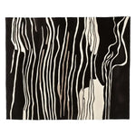 Elegant area rug with a striking abstract black and white zebra stripe pattern, perfect for adding a contemporary touch to any living room. This hand tufted wool rug combines modern aesthetics with the warmth and texture of natural fibers, making it an ideal choice for stylish living room area rugs.