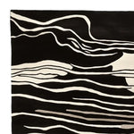 Stylish Modular Art Beat Hand Tufted Area Rug showcasing an abstract black and white pattern. This contemporary wool rug is perfect for adding a modern touch to living room area rugs.