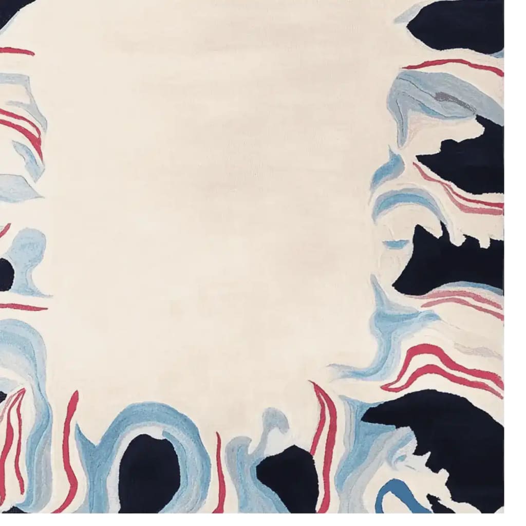 The Molten Edge Mirage Hand Tufted Area Rug features an abstract design with flowing blue, red, and black patterns on a cream background, perfect for contemporary living rooms. This wool rug in an 8x10 size adds a touch of modern elegance and artistic flair to large living spaces.