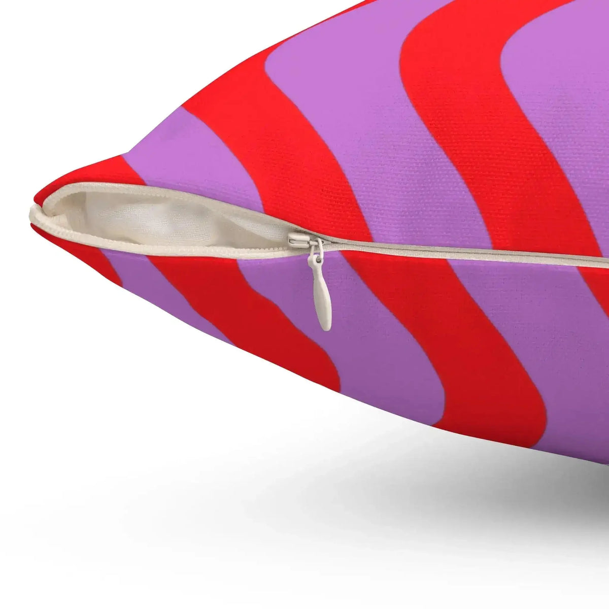 Colorful pop-inspired accent throw pillow featuring bold red and purple wave patterns, perfect for adding a playful touch to any decor.