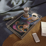 tray with monkey art portrait displayed on wicker mat surface overhead view with phone nearby