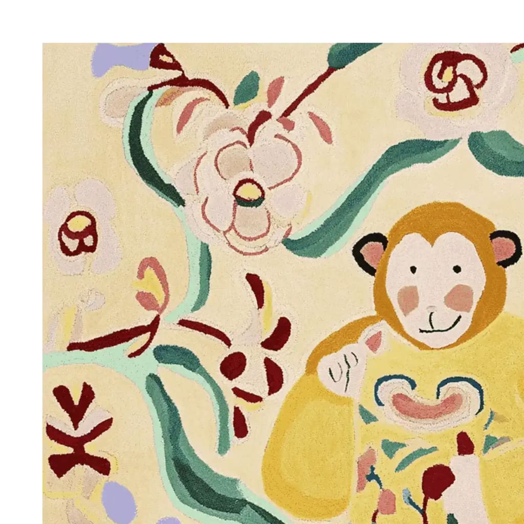 The Monkey Flower Song Hand Tufted Rug features a whimsical design with a playful monkey amidst vibrant flowers and swirling patterns. This contemporary area rug, crafted from soft wool, adds a touch of charm and warmth to any living room space.