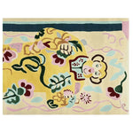 A vibrant hand-tufted area rug featuring an abstract monkey design with colorful floral and leafy patterns. The contemporary wool rug is perfect for a living room, sized at 8x10, adding a playful and artistic touch to any space.