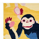 A vibrant hand-tufted area rug featuring a playful monkey design in bold colors, perfect for adding a touch of whimsy to contemporary living rooms. This wool rug, ideal as an 8x10 living room centerpiece, combines artistry and comfort for a unique decor statement.