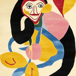 Vibrant and artistic Monkey Spirit Hand Tufted Area Rug featuring an abstract design with bold colors like red, yellow, pink, and blue. This contemporary wool rug is perfect for adding a splash of creativity to living room area rugs.