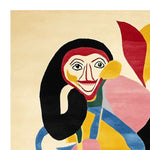 A vibrant hand-tufted area rug featuring an abstract monkey design with bold colors like red, yellow, and blue. This contemporary wool rug adds a playful touch to living room area rugs, perfect for those seeking unique area rugs for living room decor.