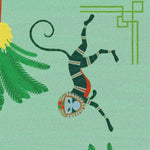 Close-up of a hand-tufted area rug featuring playful monkeys and lush palm tree designs, perfect for adding a boho touch to your living room or office. Made from high-quality wool, this rug brings an exotic flair and warmth, making it an ideal choice for living room area rugs and rugs for living room spaces.