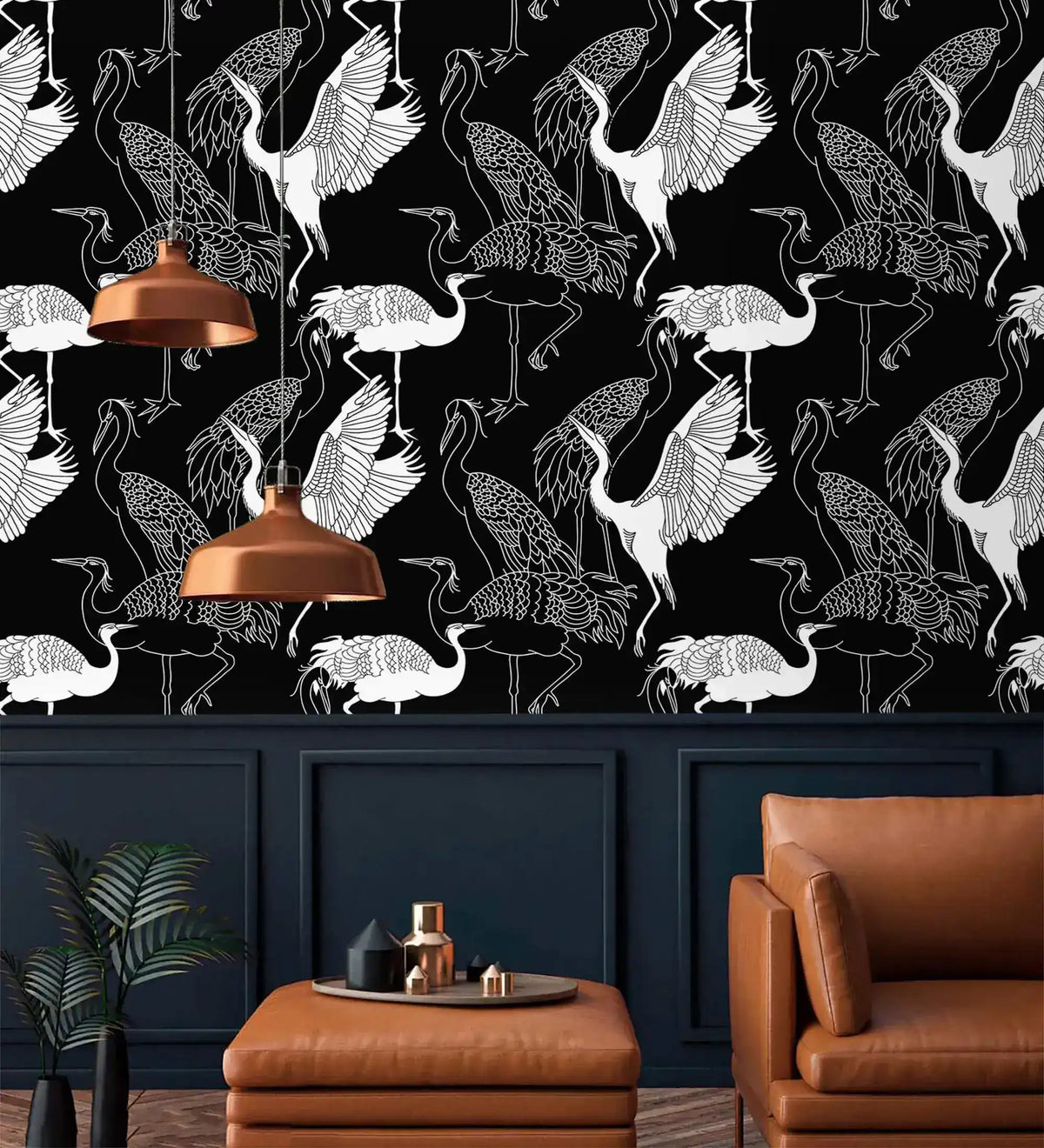 Monochrome crane wallpaper with white cranes on black above navy panelling with copper pendant lights