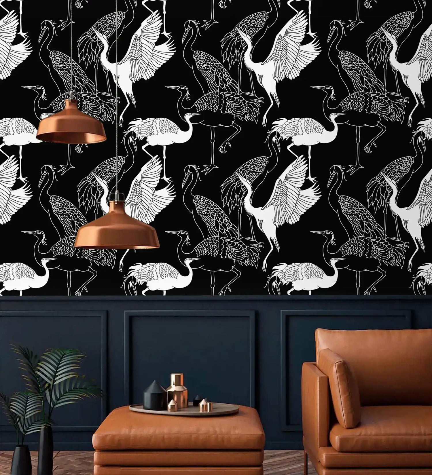 Monochrome crane wallpaper with white cranes on black above navy panelling with copper pendant lights