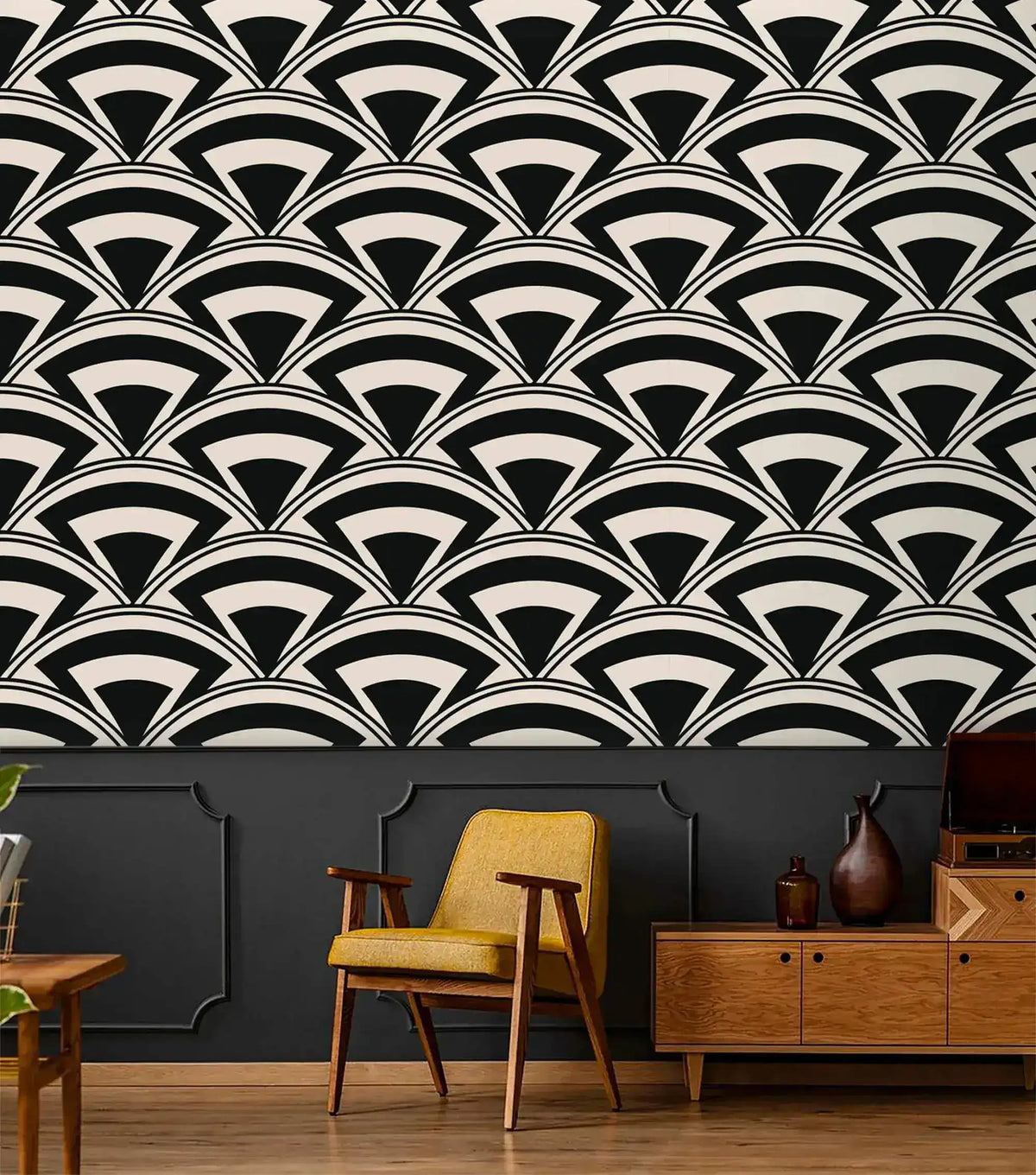 Monochrome deco fan wallpaper above dark wainscoting with mustard mid-century chair and wood credenza