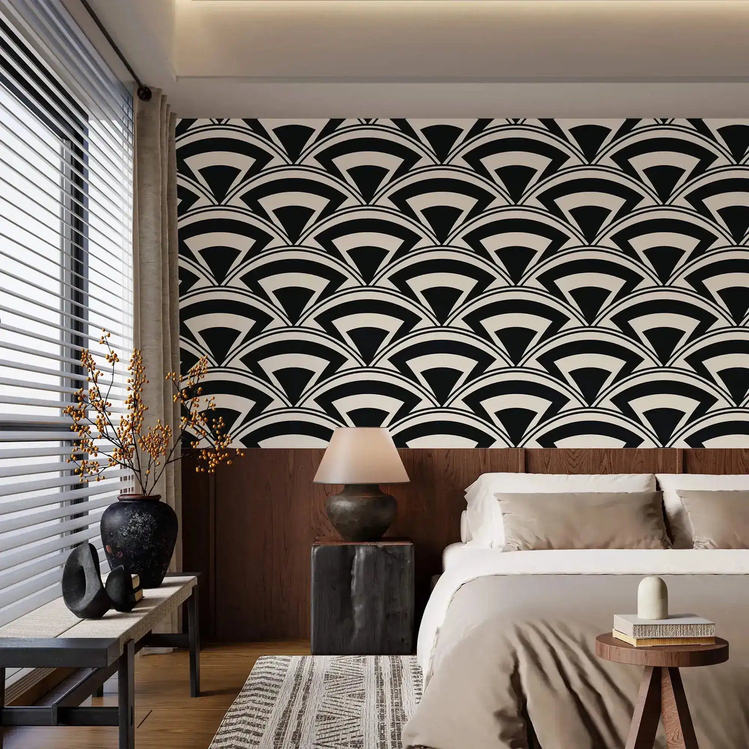 Monochrome deco fan wallpaper in black and cream above wood paneling in a calm neutral bedroom