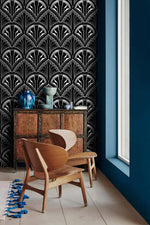 Monochrome Deco Floral Wallpaper in black and white beside a red cabinet and wood chairs