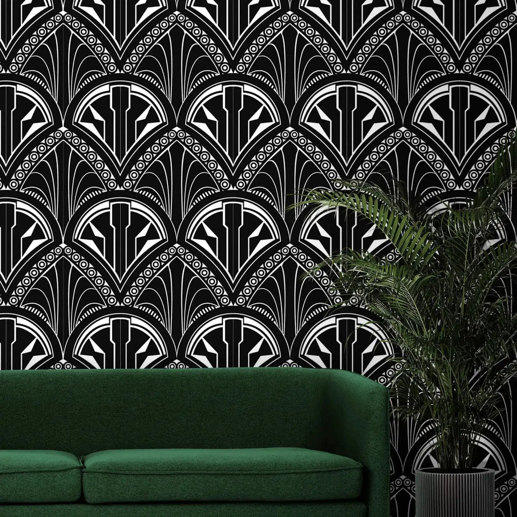 Monochrome Deco Floral Wallpaper in bold black and white above a green sofa and fern