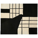 This image features the Monochrome Gride Form Hand Tufted Rug, an elegant area rug with a contemporary design. The rug showcases a striking black and white grid pattern, perfect for modern living rooms. Made from high-quality wool, this 8x10 rug is ideal for adding a stylish touch to your space.