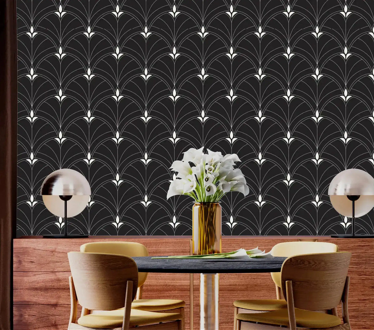 Monochrome Majesty black Art Deco arch wallpaper as feature wall in dining room with wood wainscoting and globe pendant lamps