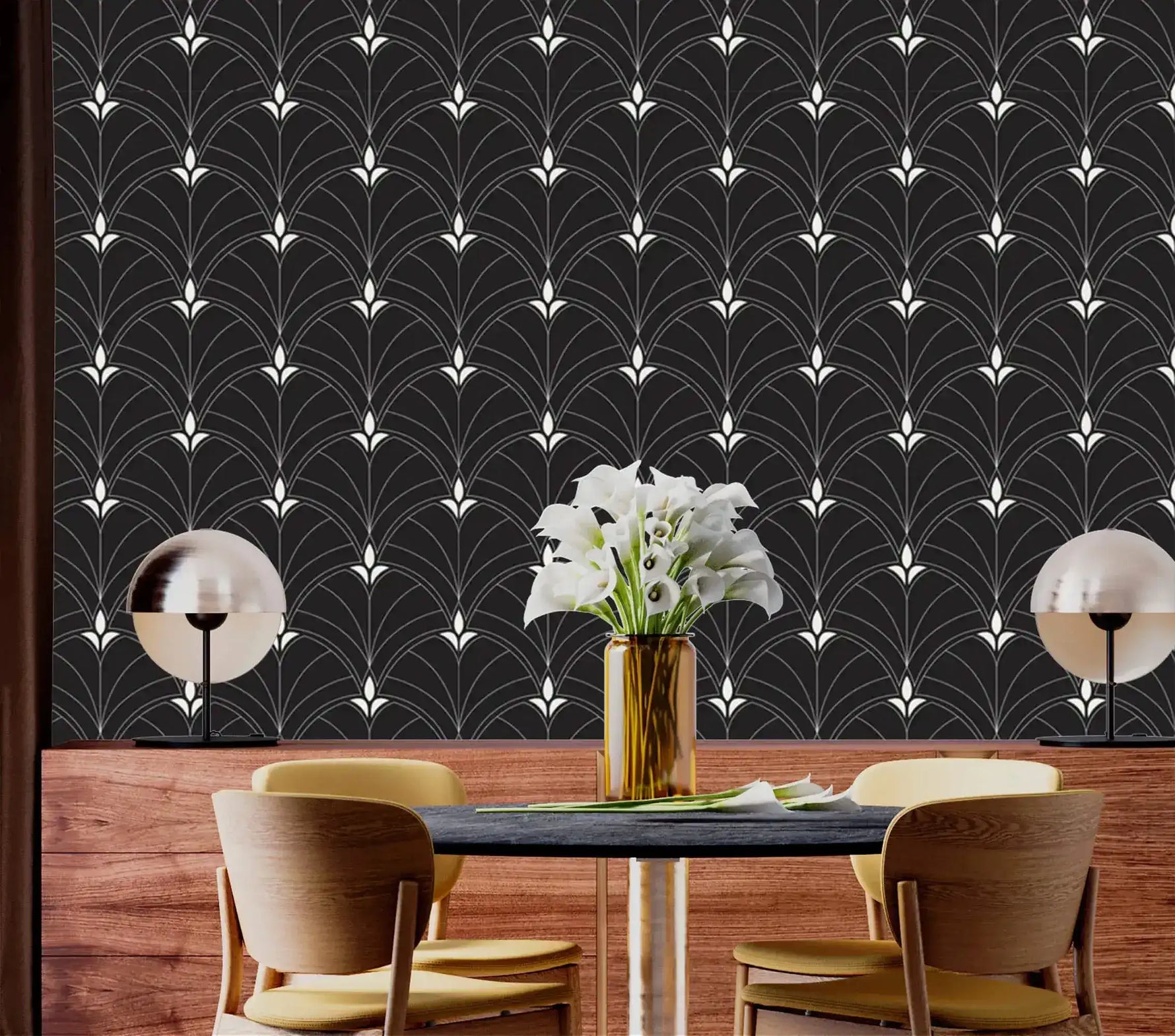 Monochrome Majesty black Art Deco arch wallpaper as feature wall in dining room with wood wainscoting and globe pendant lamps