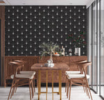 Art Deco arch wallpaper in black with white fan motifs behind a walnut dining set, floor-to-ceiling glass window beside