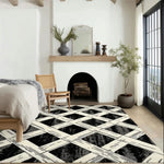 Stylish bedroom featuring a Monochrome Weave Hand Tufted Rug. This large area rug offers a striking black and white geometric pattern, perfect for adding a modern touch to your bedroom decor. Ideal for those seeking high-quality wool rugs that enhance the warmth and style of a bedroom setting.
