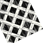 Close-up view of the Monochrome Weave Hand Tufted Rug, showcasing its intricate black and white lattice design. This large area rug, perfect for bedrooms, is crafted from high-quality wool, making it a stylish and durable choice for any bedroom decor.