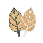 A beautifully crafted Monstera Leaf Shape Jute Rug, perfect for enhancing the aesthetic of your living room or office. This elegant area rug features a natural jute texture, designed in the shape of two overlapping leaves with stylish green and white vein accents, adding a touch of nature-inspired elegance to any space.