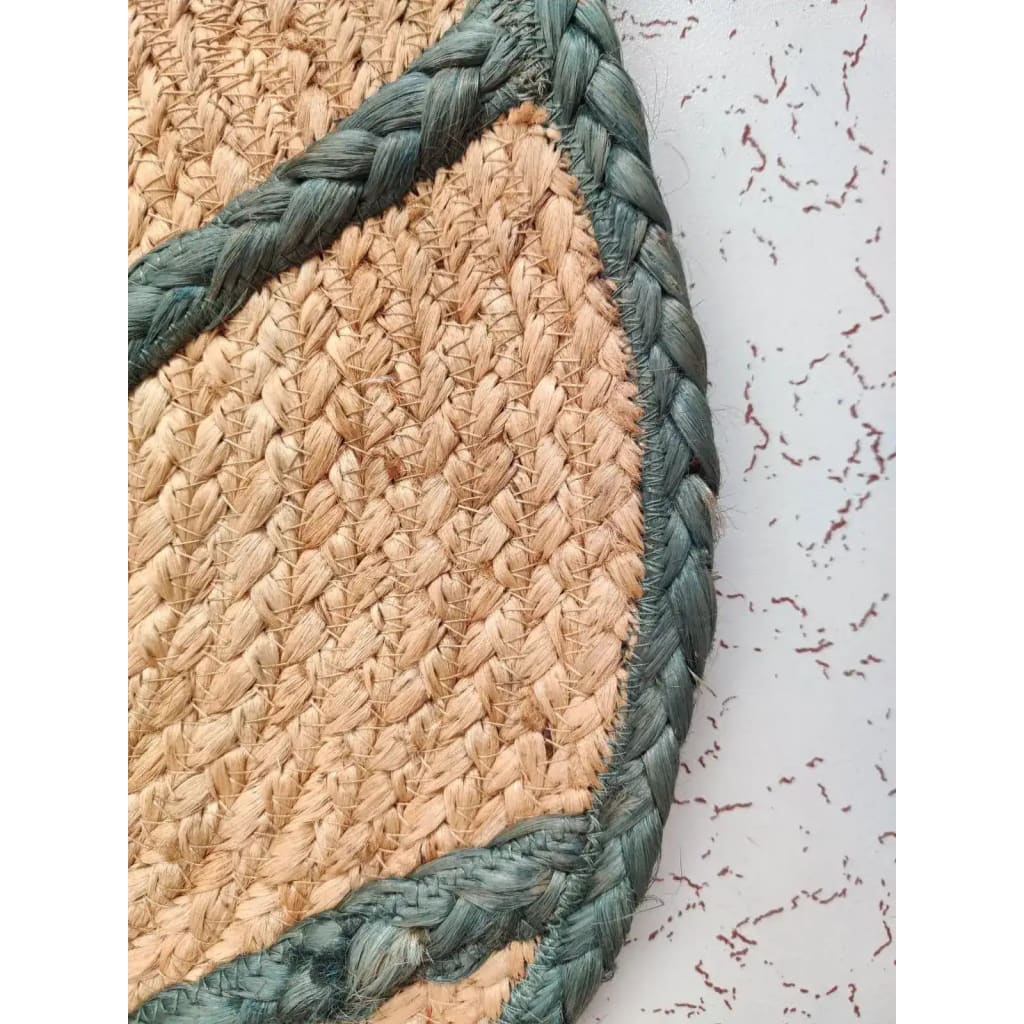 Close-up view of a Monstera Leaf Shape Jute Rug showcasing its intricate weave pattern, perfect for adding a natural touch to living room area rugs or as rugs for office spaces.