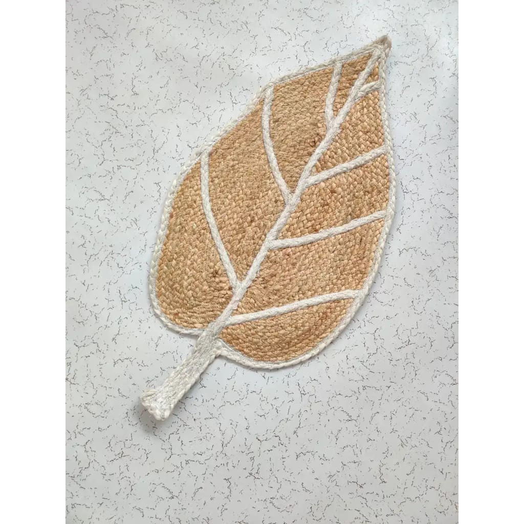 A beautifully crafted Monstera Leaf Shape Jute Rug, perfect for adding a natural touch to your living room or office. This area rug features intricate detailing in a leaf pattern, making it a stylish choice among living room area rugs or rugs for office spaces.