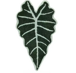 Black and white leaf-shaped rug on a white background