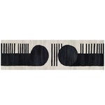 A modern runner rug featuring a bold black and white abstract design, perfect for adding a contemporary touch to kitchens, hallways, or bathrooms. This hand-tufted wool rug showcases two large black circles and vertical stripes, ideal for those seeking stylish kitchen runner rugs or hallway runner rug options.