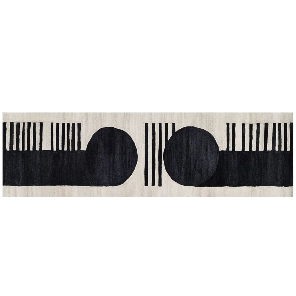 A modern runner rug featuring a bold black and white abstract design, perfect for adding a contemporary touch to kitchens, hallways, or bathrooms. This hand-tufted wool rug showcases two large black circles and vertical stripes, ideal for those seeking stylish kitchen runner rugs or hallway runner rug options.