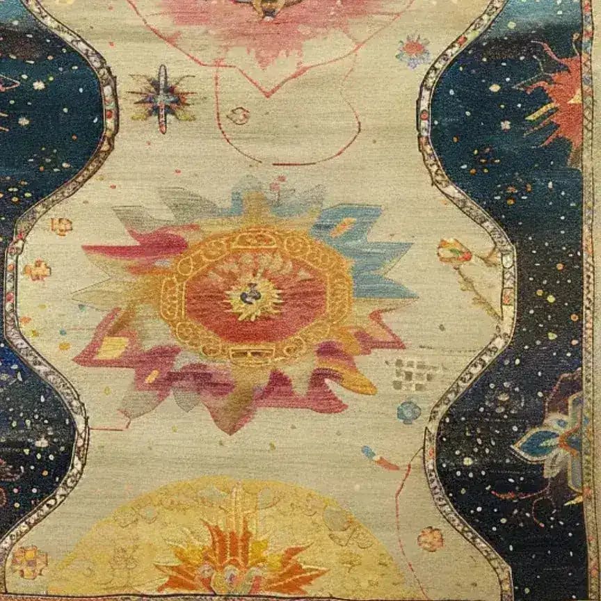 Top view of the Moonlit Meadow Hand Knotted Area Rug showcasing its intricate, celestial design. This elegant piece, perfect for living room area rugs, features a blend of vibrant colors and Persian rug motifs, ideal for adding a touch of artful sophistication to any space.