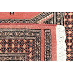 Close-up view of the Moroc Hill Wool Hand Knotted Area Rug Runner showcasing intricate geometric patterns and warm earthy tones. Perfect for enhancing living room decor, this rug offers a luxurious touch to any space, ideal for those seeking stylish and cozy living room area rugs or rugs for living room settings.