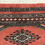 Close-up view of the Moroc Hill Wool Hand Knotted Area Rug, showcasing its intricate geometric patterns and rich colors, perfect for enhancing living room decor. This elegant piece is ideal for those seeking unique rugs for living room spaces.
