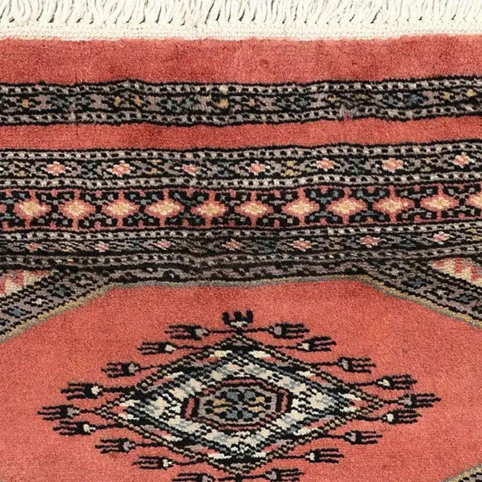Close-up view of the Moroc Hill Wool Hand Knotted Area Rug, showcasing its intricate geometric patterns and rich colors, perfect for enhancing living room decor. This elegant piece is ideal for those seeking unique rugs for living room spaces.