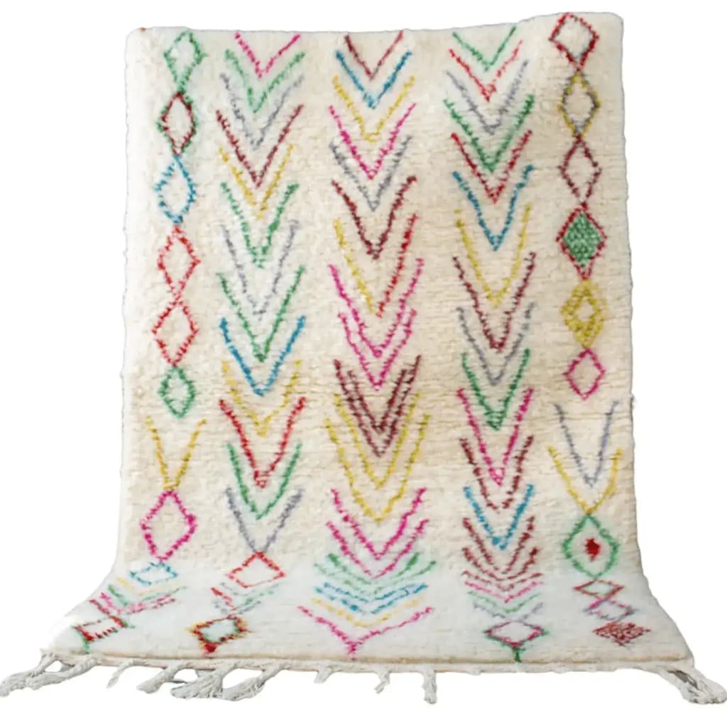 Vibrant Moroccan Bright Geometric Azilal Berber Wool Rug featuring colorful patterns on a white backdrop. This area rug, ideal for large living room spaces, showcases a vintage charm with its intricate design.
