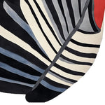 A contemporary area rug featuring a striking abstract design with bold black, white, and gray stripes, accented by a touch of red. This wool rug is perfect for adding a modern flair to your living room, ideal as a large living room rug.